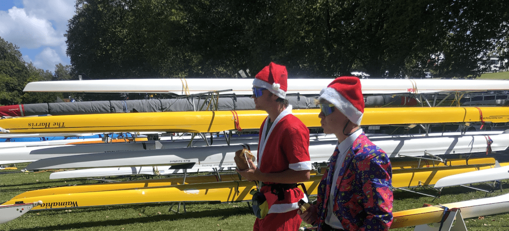 rowing in santa hats