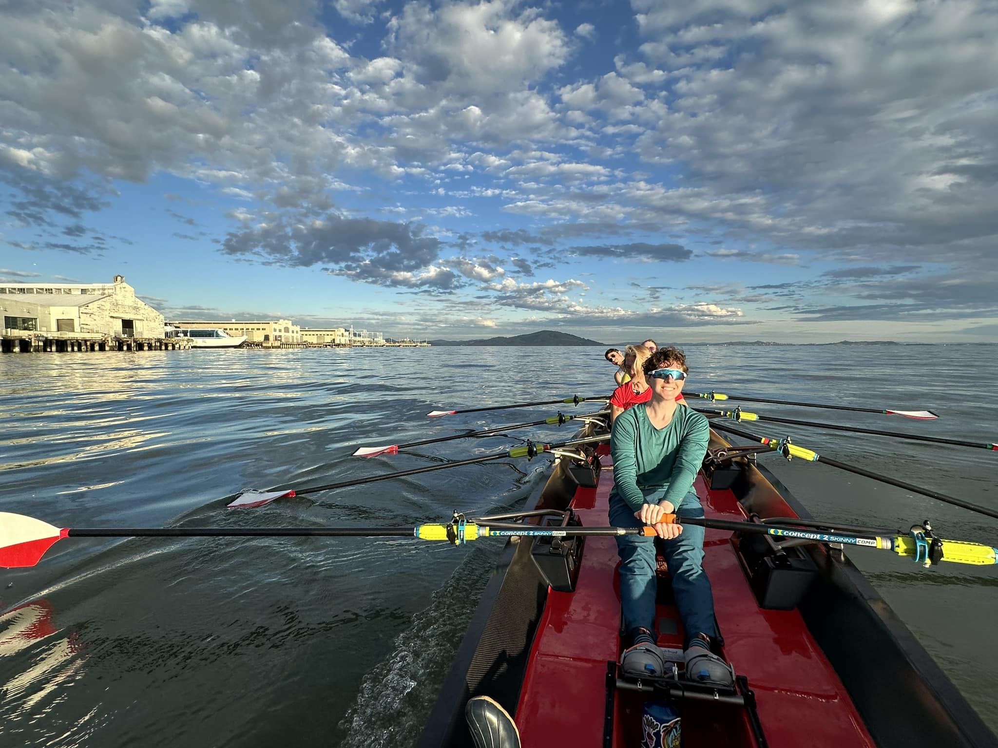 Four women in a rowing boat on San Francisco bay.