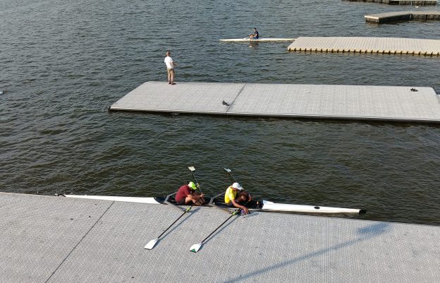 double scull rowing boat on a gray dock waiting to go rowing