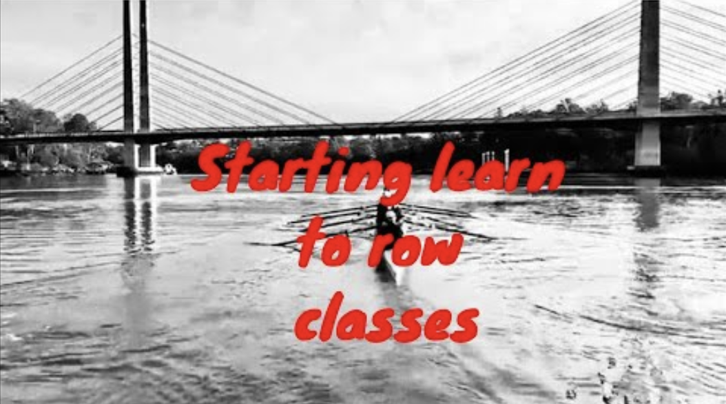 Rowing eight going under a suspension bridge